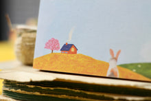 Lade das Bild in den Galerie-Viewer, Kleiner Notizblock - Kaninchen auf Blumenwiese - Frühling - Blanko - A7 - 50 Seiten