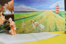 Lade das Bild in den Galerie-Viewer, Postkarte - Schafe auf Deich - Nordsee mit Leuchtturm - Aquarell Illustration - Handgemalt - Geburtstagskarte