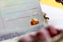 Lade das Bild in den Galerie-Viewer, Postkarte - Hase im Schnee - Polarlichter - Berglandschaft mit Hütte - warm and cozy holiday - Weihnachten Winter - Eigene Illustration