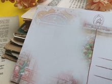 Lade das Bild in den Galerie-Viewer, Postkarte - Buchladen im Schnee - Weihnachten - orange cat bookshop - Aquarell - Cozy - Hund - Katze - Bücher - Eigene Illustration