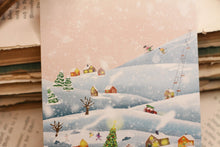 Lade das Bild in den Galerie-Viewer, Postkarte - Winterdorf - Grußkarte für Weihnachten - Hund im Schnee - idyllische Landschaft - Eigene Illustration