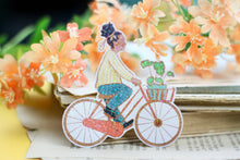 Lade das Bild in den Galerie-Viewer, Vinyl Sticker mit Holographischem Effekt - Frau auf Fahrrad - BIPoC - Hollandrad - Pflanzen
